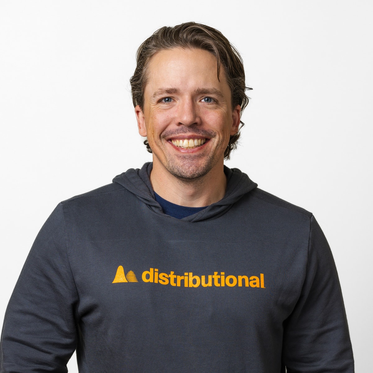 Scott Clark, CEO, Distributional, headshot in a Distributional hoodie, hands in pockets, square crop