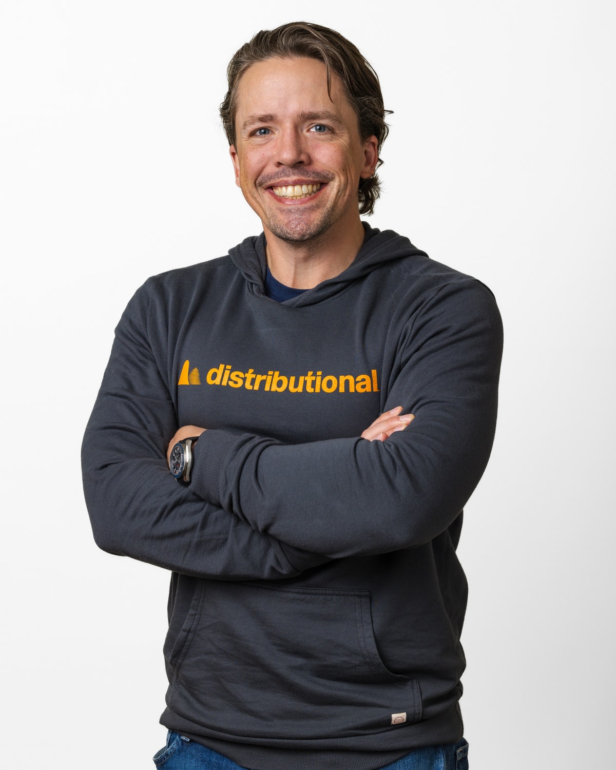 Scott Clark, CEO, Distributional, headshot in a Distributional hoodie, arms crossed, 4:5 portrait crop
