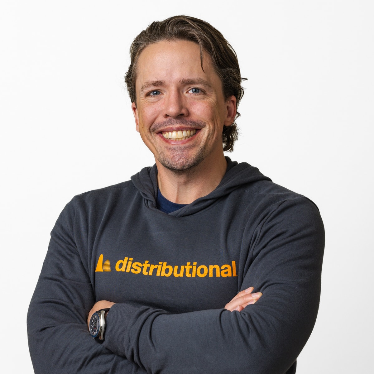 Scott Clark, CEO, Distributional, headshot in a Distributional hoodie, arms crossed, square crop